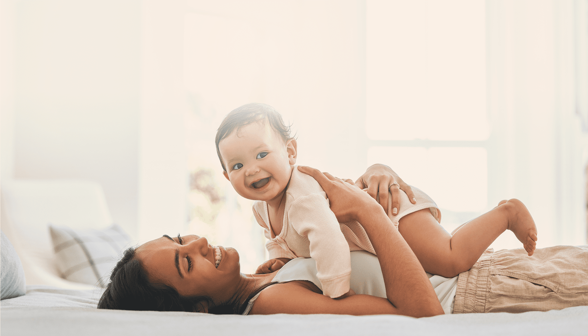 Happy baby with smiling parent
